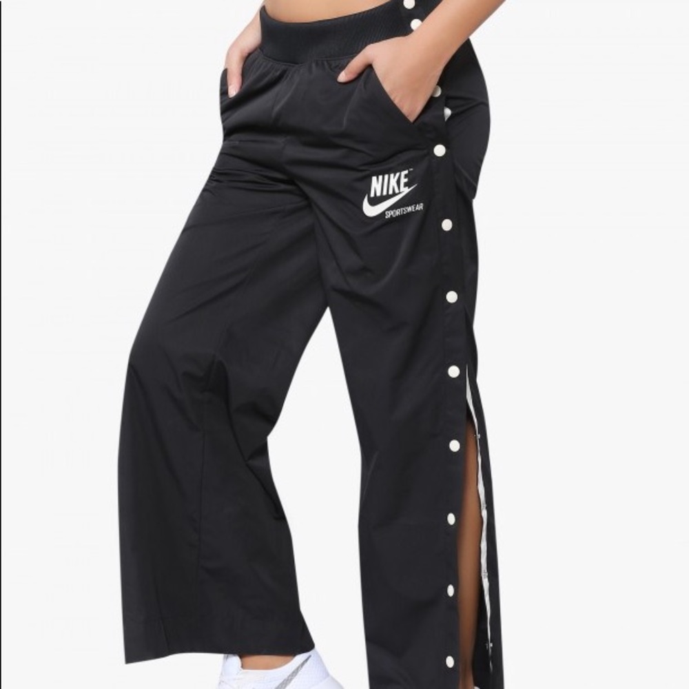 Nike track pants with buttons down the side. 🖤🖤
